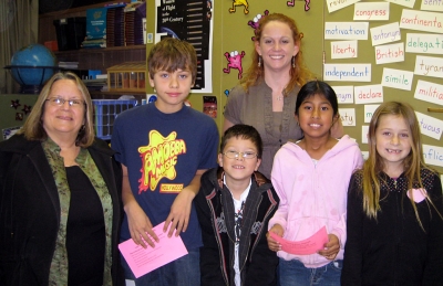 Pictured are Principle Jan Marholin, Diego Aparicio Rodrigues, Sammy Estrada, Perla Chavez Hernandez, and Taylor Wright, with Mrs. Walker.