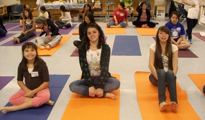 Valeria Villa, Blanca Ayala, and Jenna Mendez all enjoy a yoga exercise.