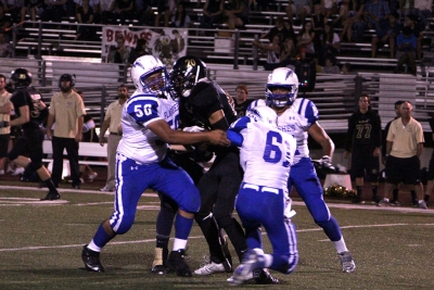 Omar Valdivia and 61 Gil Sandoval Keep Oak Park from getting the first down.