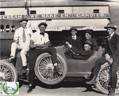 Men in front of Mack Wooldridge's Orange Leaf Café. 