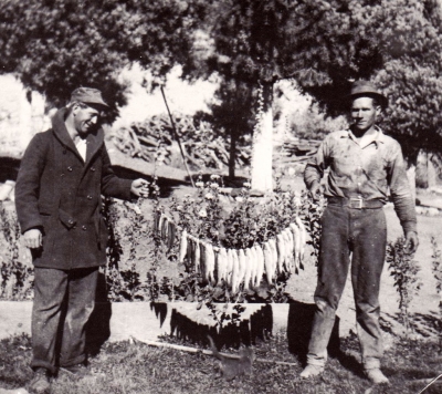 (right) Charlie Brown. Fishing catch, circa 1930.