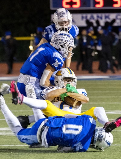 Pictured are Flashes JV players teaming up to stop an Agoura player from advancing downfield during Friday night’s game. Photo credit Crystal Gurrola. 