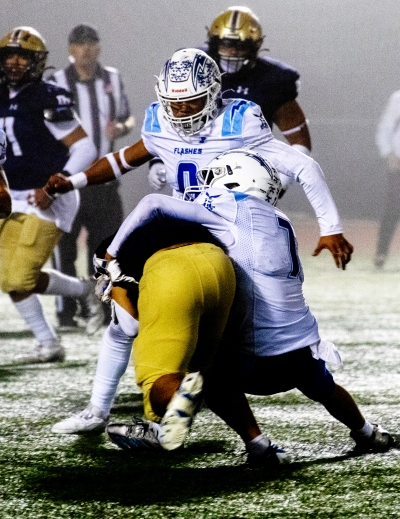 Pictured right is Flashes Varsity tackling a Dos Pueblos player in last Friday’s game. Photo credit Crystal Gurrola.