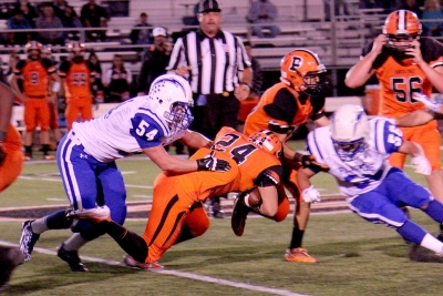 Varsity #54 Chad Petuoglu making a tackle