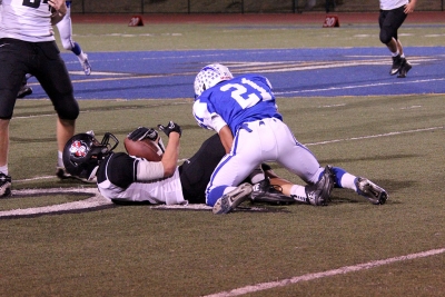 #21 Damien Gonzalez makes a tackle