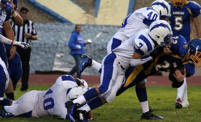 J.V. #40 Alex Vargas and #7 Hector Sanches stop the run