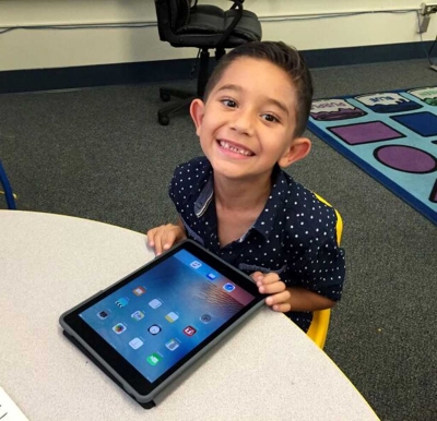 Piru Elelmentry student is all smiles about the school’s new iPads.