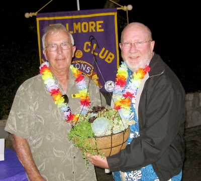 Lion President Bill Dewey (left) presents a gift to installing PCC Bill Dunlevy.