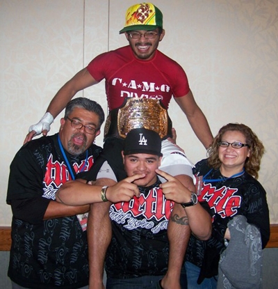 Francisco “Turtle” Estrada pictured with his family (l-r) Rafael Estrada, Jose “Froggy” Estrada, and Norma Ramos, right after he won the Championship at the Westlake Hyatt.