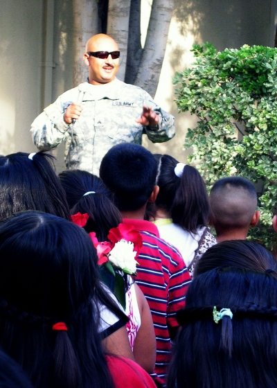 Serviceman Val Pillado speaks to Piru students.