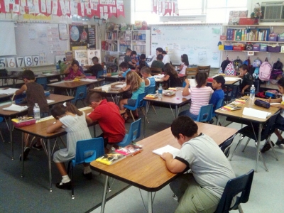 First grade students are hard at work in their classroom.