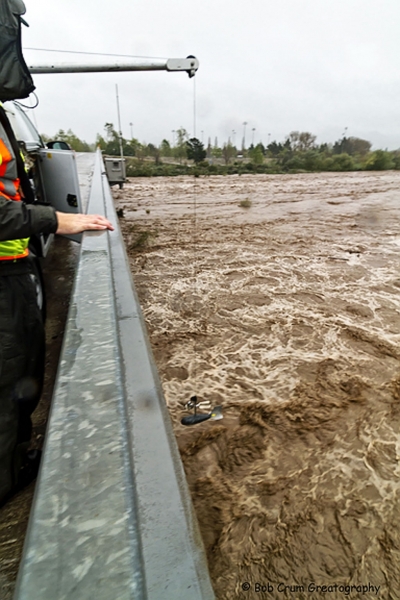 The measuring device about to enter the water below.