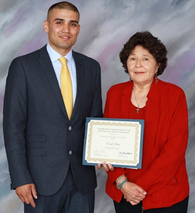 (l-r) Erick Pina and Lydia Martinez-Collins who presented the Martinez y Ewens Anasazi Annual Scholarship.