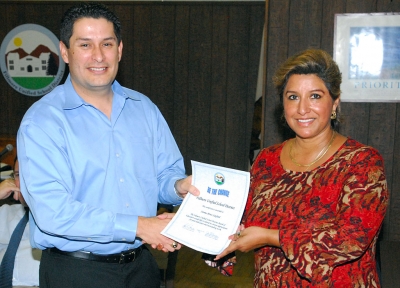 School Board President John Garnica with Norma Perez-Sandford. Perez-Sandford received “Be the Change” certificate at Tuesday night’s meeting.