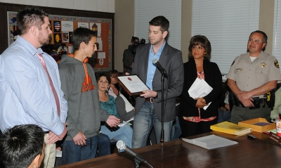 At Tuesday night’s school board meeting Joey Orozco (left) received a Certificate of Congressional Recognition from a representative of Congressman Elton Gallegly for his achievements at R.M. Pyles Boys Camp.