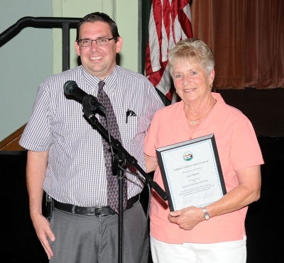 Scott Carol, Principal of Sespe Elementary, presents Sespe Cafeteria Supervisor Lou Hoover, also known as Grandma Lou, the Classified Employee of the Year.