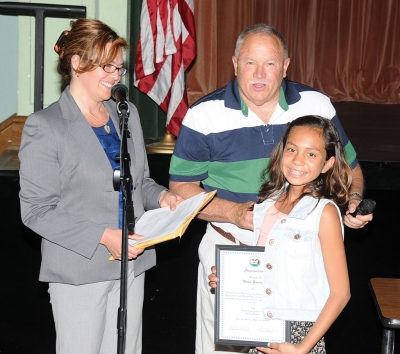 Migrant Parent of the Year Maria Ramirez, Ramirez was ill, but her daughter accepted the plaque in her honor.