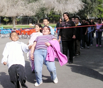 Fifth grade students wait in line to see how low they can go.