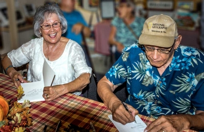 Pictured are co-authors Becky and Ernie Morales at this past Saturday’s book signing. Photo Courtesy of Bob Crum.