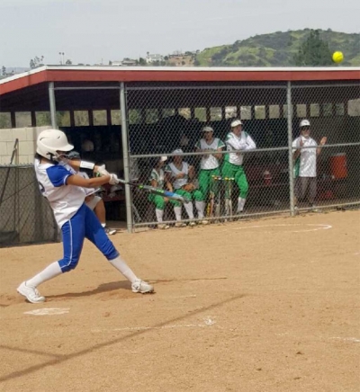 Freshman Jazmine Zavala knocking her first high school homerun out of the park.