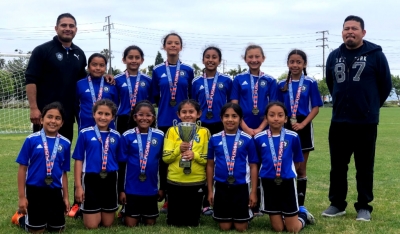 Pictured is the Fillmore’s California United 2008 Girls Soccer Team. Top row (l-r) Head Coach David Vaca, Anel Castillo, Alondra Leon, Lizbeth Mendez, Valerie Rubio, Jazleen Vaca, Nathalia Orozco, and Assistant Coach Aciano Mendez. Bottom row (l-r) Jiselle Posadas, Leanna Villa, Joelle Rodriguez, Delila Ramirez, Sara Diaz, and Danna Castillo. Not pictured: Fiona Cabral and Assistant Coach John Cabral.