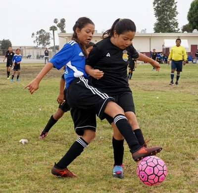 California United U-10 Girls player as she tries to steal the ball from Oxnard Real in their game this past Saturday.