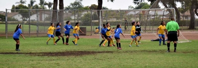 Corner – The offense looks to make a play off a corner kick as they battle for position down in the box.