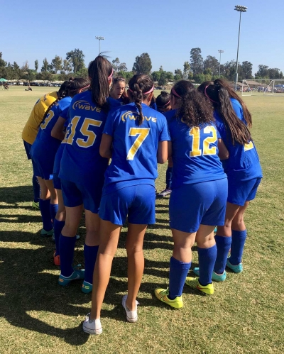 The Oxnard Wave team huddle together to get ready for the games this past weekend.