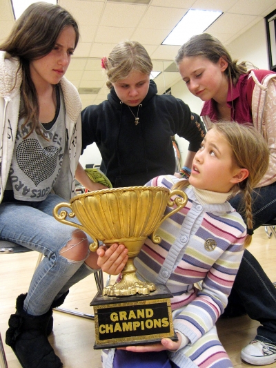 (l-r) Kaitlin Gates, Lauren Alexander, Deanna Bitterly, and trophy holder Caris Kozak.
