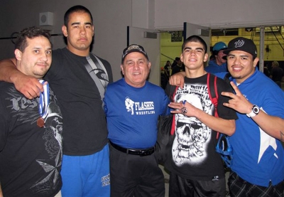 (l-r) Coach Ponce, Marco Vega (heavyweight took seventh place), Coach Cal, Robert Bonilla (132 lbs took third place), and Coach Froggy. It's been over ten years since a Fillmore wrestler placed at this tournament. There were over 20 schools participating.
