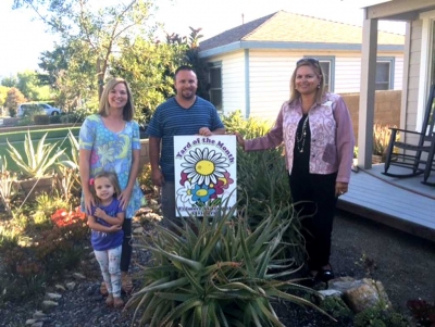 September Yard of the Month Winner’s (l-r) Brynn, Megan, Eli Hernandez and Ari Larson.