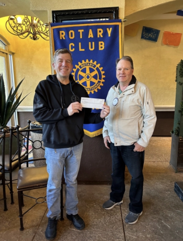 Rotarian Scott Beylik (right) presented Rotarian Sean McCulley with a check for $5,000 from the Rotary Foundation, for the Fillmore Towne Theatre. The theatre was built in 1916 and seats 325, and purchased by Mudturtle Theatrical, Inc. in 2021. Photo credit Martha Richardson.