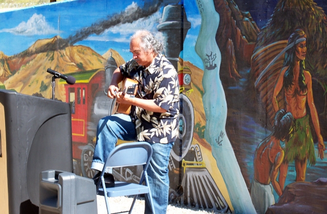 Guitarist and vocalist Enrique Ramirez of San Francisco performs at the beginning of the dedication.