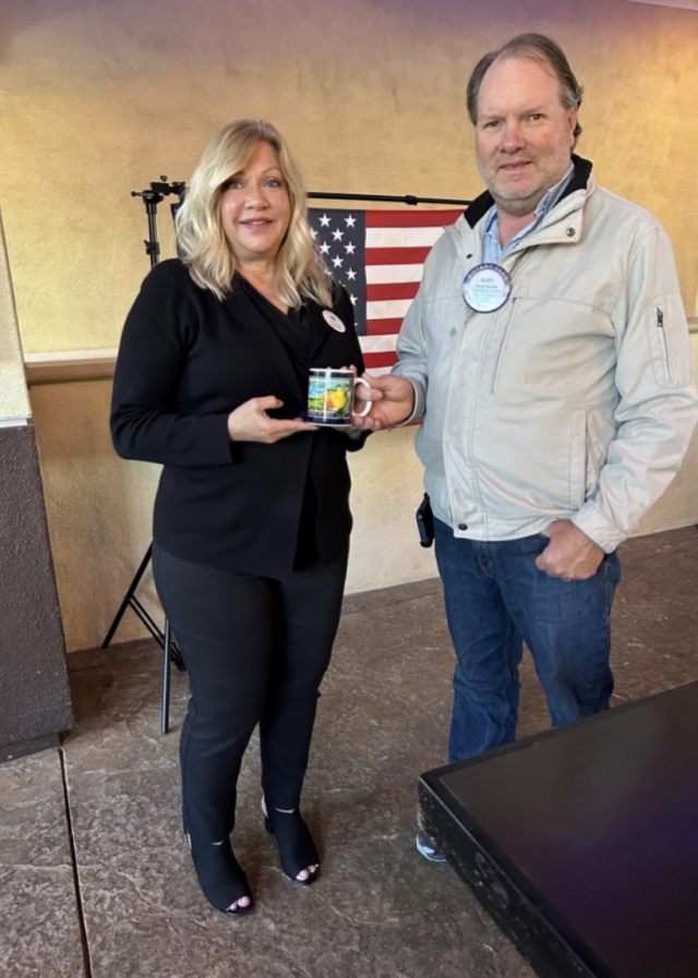 Pictured (l-r) is Rotary guest Speaker Allison Barker who was presented a mug from Club president Scott Beylik. Photo credit Rotarian Martha Richardson.
