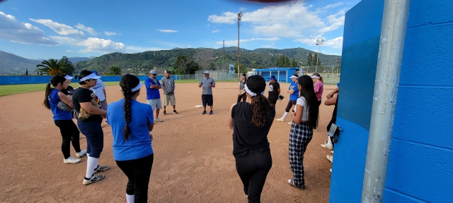 Above is the Fillmore Flashes Girls Softball crew having a team chat with coaches after they finished practice for the day. They are getting ready for their game away this Thursday, March 21, at 3:30pm against Santa Paula.