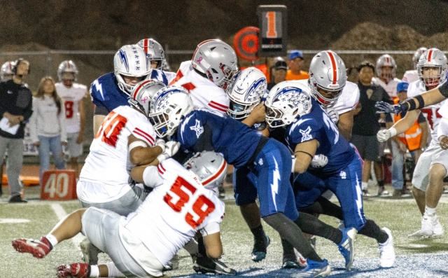 Above is the Flashes Varsity football game against Hueneme High School last Friday, with a group of Flashes going head-to-head with the Vikings to keep them from advancing. FHS Varsity defeated the Vikings, 42-0. Photo credit Crystal Gurrola. 