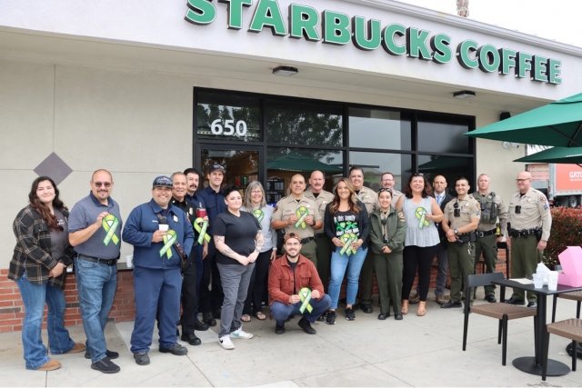 On Tuesday, May 16, the Fillmore Police and Fire Departments held “Coffee with the
Badges” in support of the First Responders for Mental Health Awareness Initiative. From
8am to 10am at Starbucks in Fillmore they enjoyed their coffee while they mingled with
the residents in an effort to build better relationships with the Fillmore community. Photo
credit Angel Esquivel-AE News.