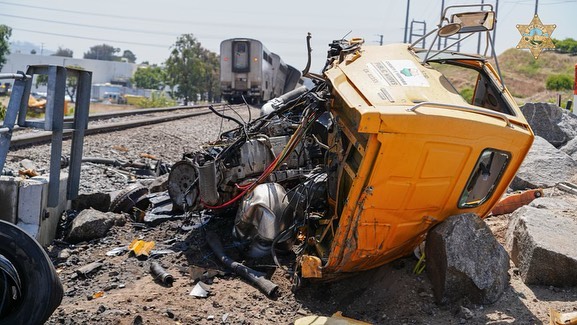 On Wednesday, June 18, at 11:19am a call involving a train was dispatched for the city of Moorpark. The location was the tracks near the address of 11128 West Los Angeles Avenue. The call was reported as a train derailment. The derailment occurred after an Amtrak train struck a vehicle on the tracks near the location. The train was reported to have a locomotive and car county made up of two locomotives, two coaches, three sleepers, one diner, one lounge and one baggage car. At least three of the cars derailed from the tracks, but remained upright. The vehicle was a tanker style truck with County of Ventura Public Works identification A battalion chief at the scene said the truck was occupied with one person. The person was transported with what had been reported as moderate injuries, according to VC Fire. An updated count of fourteen passengers were transported with what VC Fire was listing as minor level injuries. A total of 186 passengers, and thirteen Amtrak crew members were on board.
A very large emergency authority dispatch of dozens of units from departments across the county responded to assist with the incident. Los Angeles Avenue between Tierra Rejada and Pentair had initially been shut down as a hard closure during the beginning stages of the incident. The Sheriff's Office announced a reunification point in a tweet to their page, 