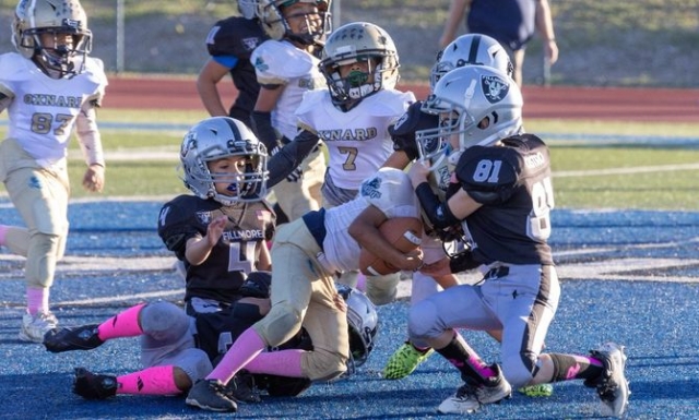 Above is Fillmore’s Mighty Mites Silver stopping Oxnard dead in their tracks in their game last Saturday. Photo credit Crystal Gurrola. See more photos online. 
