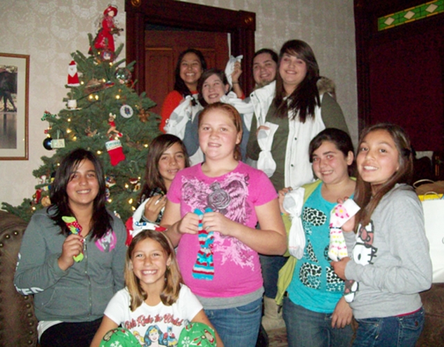 The Piru 4-H has been going to a homeless shelter in Ventura. They have been helping at the Shelter since 2009. This year they went to help serve the Christmas dinner and provided dessert—they baked and decorate cookies and cupcakes. The club helps to serve 100+ men, woman, and children. With the homeless needing socks, blankets, and warm clothes at this time of year, the club donated a total of 138 socks. They also took in coats and warm sweaters to give out. Piru 4-H really enjoys helping with this community project and looked forward to keeping it going this year!