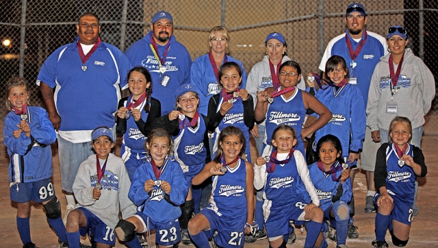 Left, a first for Fillmore Girls Softball League - The 8U team placed 2nd in the District championship game on Sunday night, the team will join the 10U and 14U in San Diego to participate in the Jr. Olympic CalState Games on July 17th, 2009. Tournament highlights include: homerun hits by Cali Wyand, Tatyana Cervantes, and Leana Venegas, triples by Tori Villegas and Tatyana Cervantes and Lindsey Brown, McKenzie Hernandez, Amanda Villa, and Cali Wyand all contributed with doubles. Leana Venegas pitched 3 1/2 games and Kasey Crawford pitched 1 and 1/2 games. Pictured left: Hailey Avila, Lindsey Brown, Tatyana Cervantes, Madeline Charles, Kasey Crawford, Jessica Harvey, McKenzie Hernandez, Chloe Stines, Leana Venegas, Amanda Villa, Victoria Villegas, and Cali Wyand, Manager Michelle Brown, Coach Leo Venegas, Coach Brian Villegas, Carlos Hernandez, Coach Carina Crawford, Coach Monique Cervantes. Photo courtesy of Richard Charles.