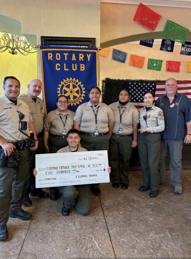 Fillmore Explorer Post #2958 visited the Rotary Club of Fillmore to thank them for their donation of $500. Those present were Sergeant Rubalcava, the School Resource Officer, and Sergeant Will Hollowell. The probationary explorers were Alina Cruz, Sophia Sanchez, holding the check, Karol Laiz, Karen Laiz, and Cadet Alfaro. Photo courtesy Rotarian Martha Richardson.