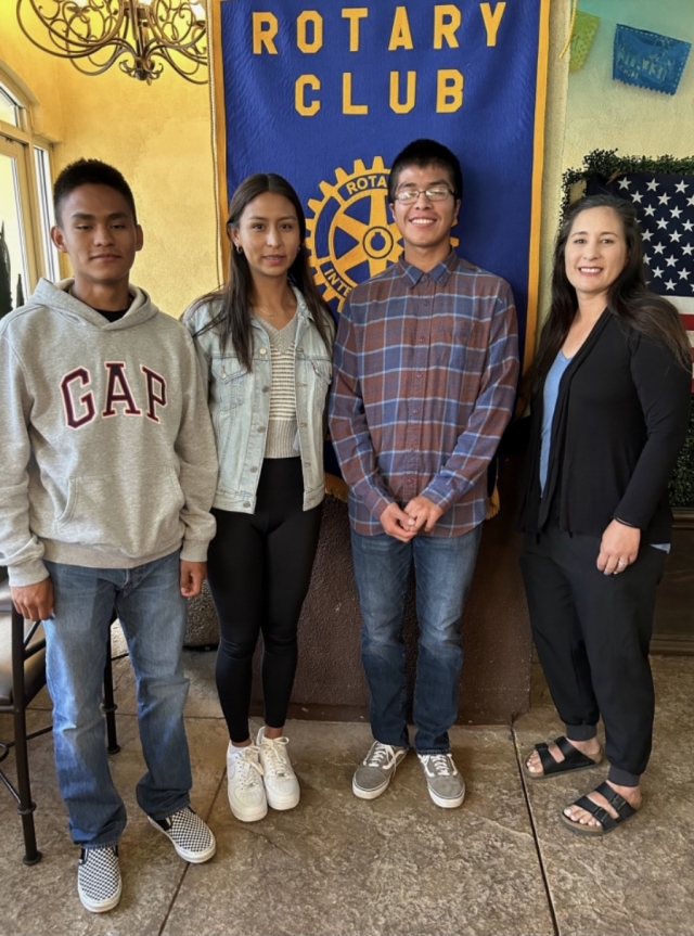 Kim Tafoya, Fillmore High Cross-Country Coach (far right), and three students (l-r), Eduardo Vigil, Nataly Vigil and Diego Ramirez, attended the Fillmore Rotary Club meeting to thank the Club for their donation of $2,000 to the Cross Country Team. Kim also announced that they are going to partner with the Rotary Club on the next 5/10K Run. Photo courtesy Martha Richardson. 