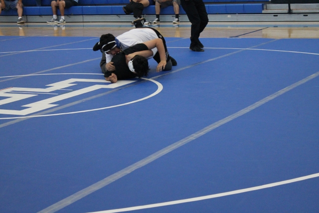 Above is Flashes Armando Avila (grade 9) taking his opponent to the floor during his match against Buena High School. Photo courtesy FHS Wrestling Coach Torres.