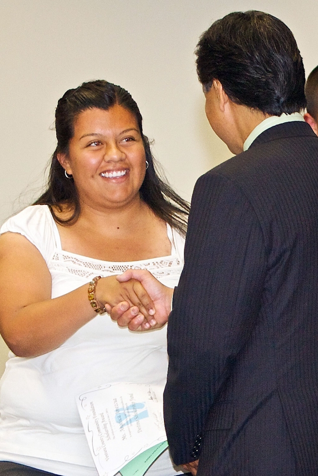 VCCF Board Chairman Pierre Tada congratulates Angelica Amezcua, of Fillmore and a student at Cal State, Northridge. Amezcua received an award from the Destino Scholarship Fund. Nearly 380 awards, totaling more than $1.35 million, were handed out on June 4 to 383 individuals. This year, a record 490 scholarships were awarded to local students by the Ventura County Community Foundation.