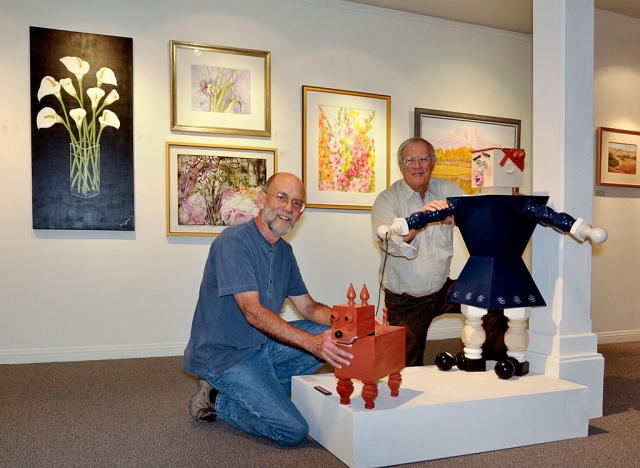 Ojai Valley Museum: Design and Hanging of Ojai Celebrates Art. Fred Kidder, Artistic Director (in grey shirt) and Roger Conrad, Exhibit Designer (in blue shirt). (Photos courtesy Myrna Cambianica)