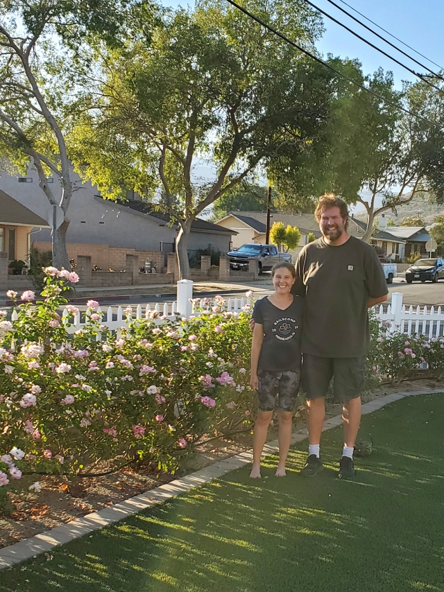 Pictured are Katie and Tony Spore, the proud gardeners of their yard near San Cayetano School in Fillmore. The Spores are
this month’s recipients of an Otto & Sons gift card for $50 as the Fillmore Civic Pride Yard of the Month for August 2022. Their garden exhibits a waterless lawn and drought tolerant established roses. Photo credit Fillmore Civic Pride.