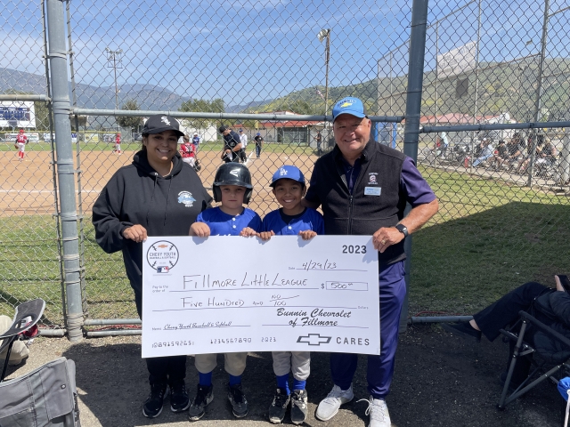 On April 29th, Shane Morger, PR director of Bunnin Chevrolet of Fillmore (right), presented a $500 check to Jacquelyn Avila, League treasurer, and players Liam Miller and Gio Avila, with Fillmore Little League. This is an ongoing program with Chevy youth sports and local dealerships like Bunnin that provide funding for local organizations like Little League to help in their funding. Photo credit Bunnin Chevrolet of Fillmore. 