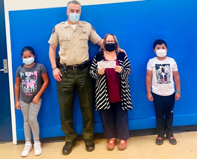 On Thursday, October 22nd, Fillmore Chief of Police Garo Kuredjian presented Jan Marholin, CEO of Boys & Girls Club of SCV, with a check for $10,000 from the Ventura County Sheriff ’s Department to support its Learning Loss Programs due to Covid-19. The clubs are connecting with youth, not only onsite but also using a virtual club which can be accessed at www.bgclubscv.org. Courtesy Boys & Girls Club of Santa Clara Valley.