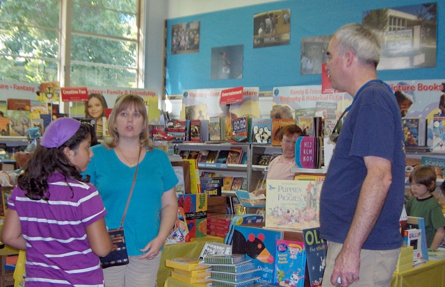 Mr. and Mrs. Chandler visiting the Book Fair.